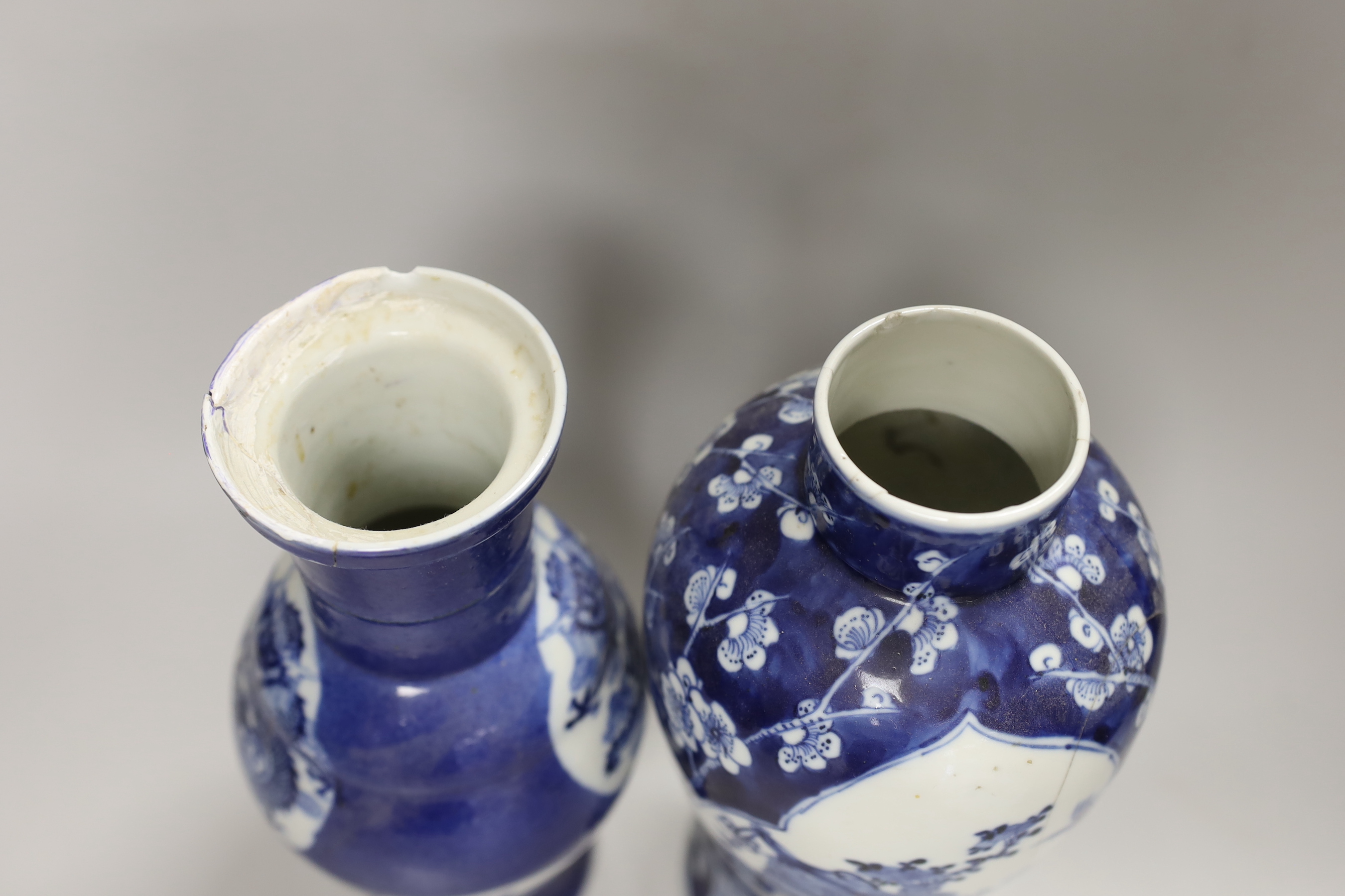 Two 19th century Chinese blue and white vases and covers, one with a dragon cartouche, the other a floral cartouche, tallest 34cm high